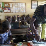 CUE_Africa_school-child-and-teacher
