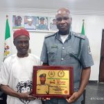 Formal presentation of the championship trophy and award of excellence to the Customs Area Controller by the NPWF leadership