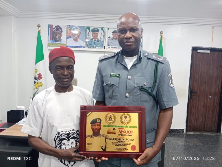 Formal presentation of the championship trophy and award of excellence to the Customs Area Controller by the NPWF leadership